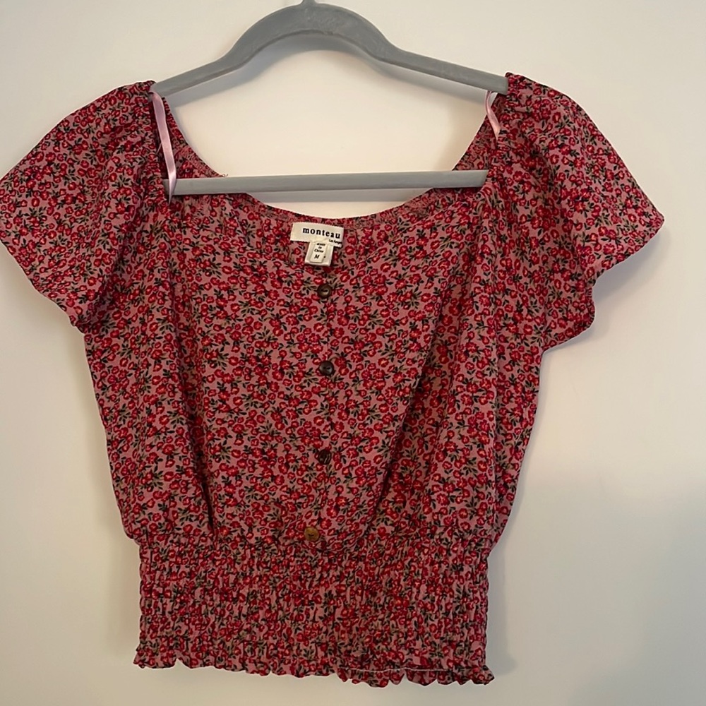 This is a woman’s cropped T-shirt size medium.